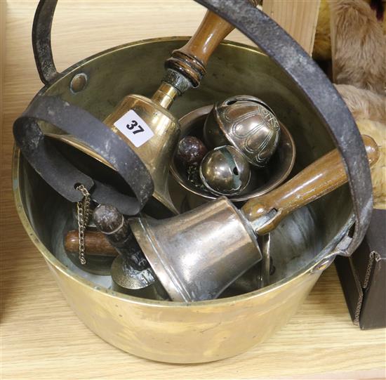 A brass pan and collection of bells etc